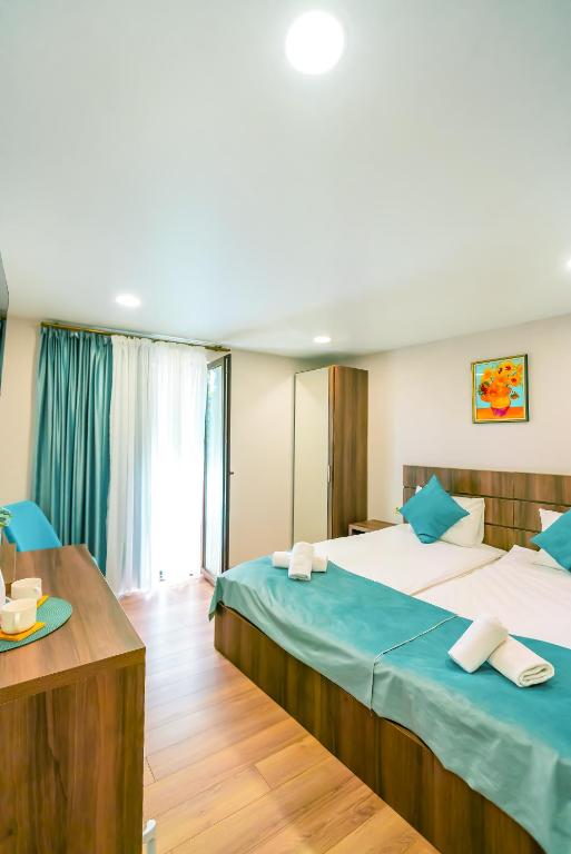 Postel nebo postele na pokoji v ubytování Hotel Classic Suites