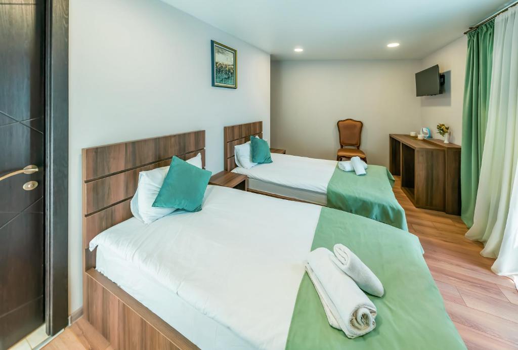 Postel nebo postele na pokoji v ubytování Hotel Classic Suites