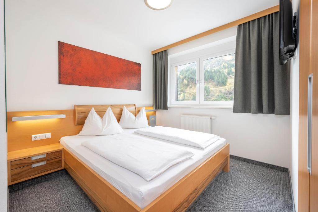 Postel nebo postele na pokoji v ubytování Sunshine Appartements Schilchegger