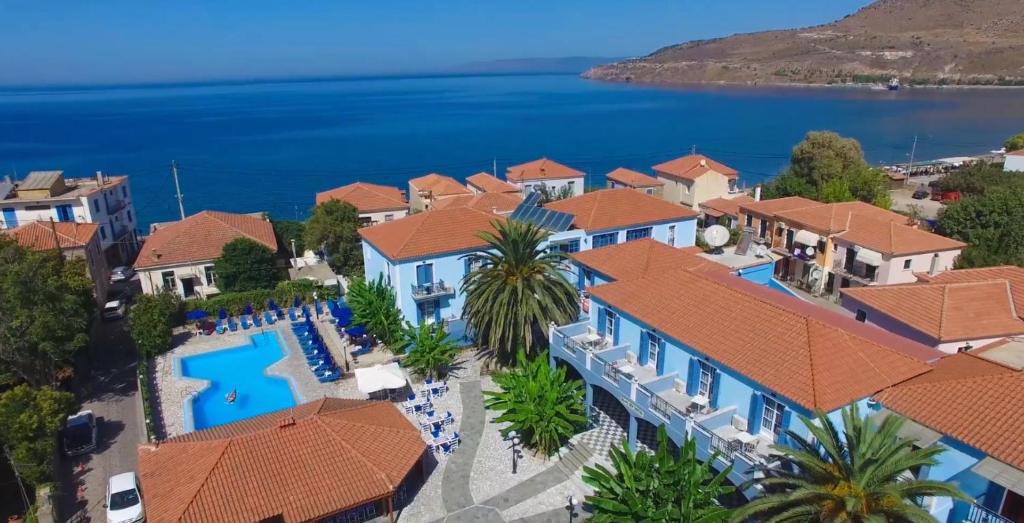 an aerial view of a resort with a pool and the ocean at Blue Sky Hotel - Petra - Lesvos - Greece in Petra