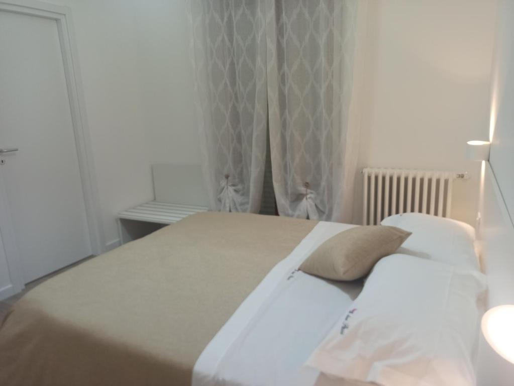 Łóżko lub łóżka w pokoju w obiekcie A Due Passi