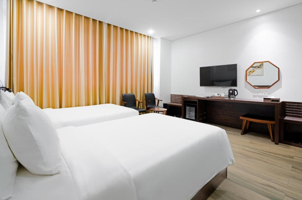 TV a/nebo společenská místnost v ubytování Emerald Bay Hotel & Spa Nha Trang