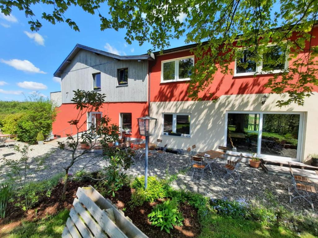 a house with a fence in front of it at Brauhaisla in Konradsreuth