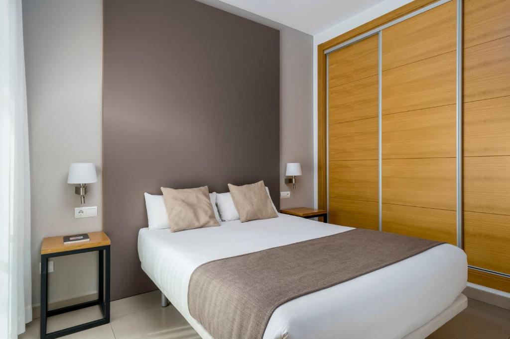 Postel nebo postele na pokoji v ubytování Suites Del Pintor