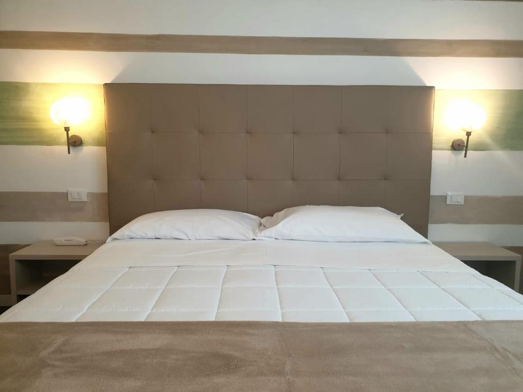 Postel nebo postele na pokoji v ubytování Hotel Grel