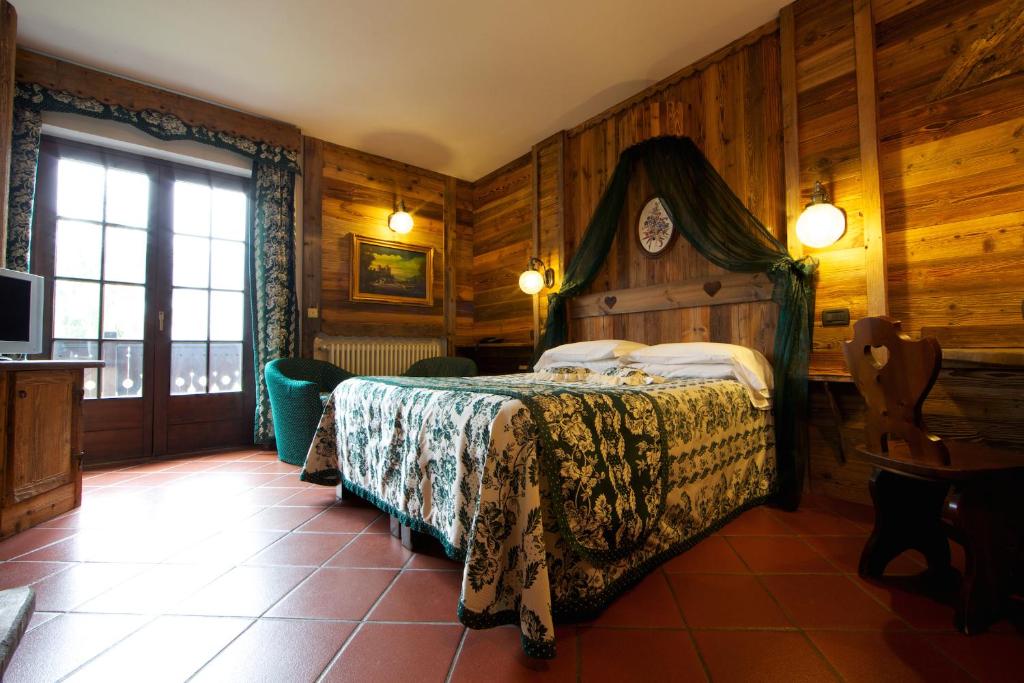 Postel nebo postele na pokoji v ubytování Hotel Milleluci