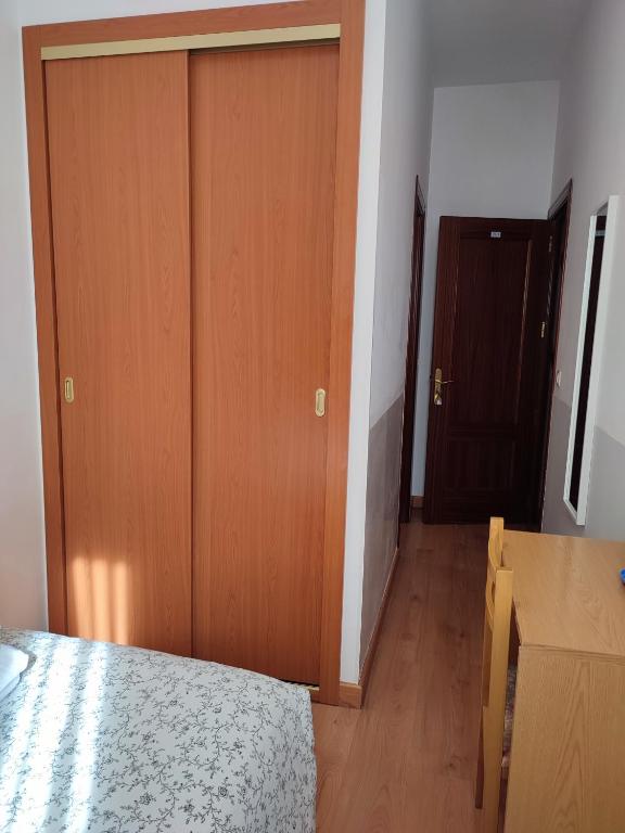 Postel nebo postele na pokoji v ubytování Hostal Salomé