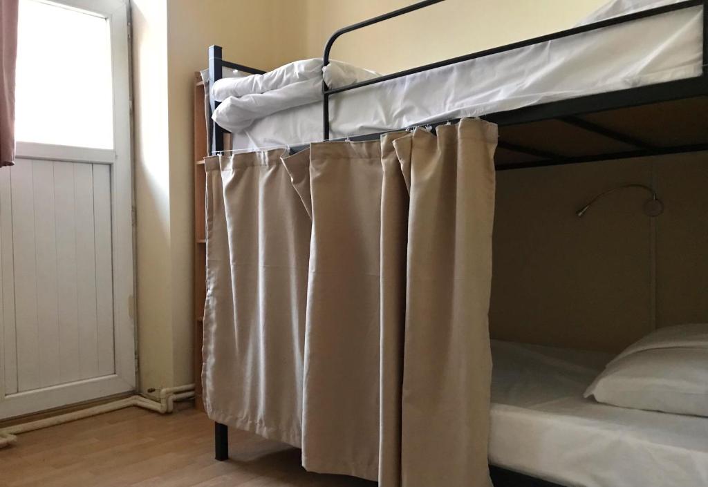 Postel nebo postele na pokoji v ubytování Wine Hostel