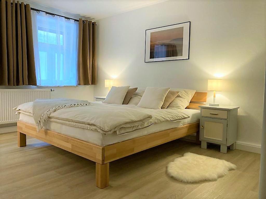 Postel nebo postele na pokoji v ubytování FeWo Ostrau, neues Bad, neue Küche, zentral, ruhig, Sandstein-Ferien, Terrasse
