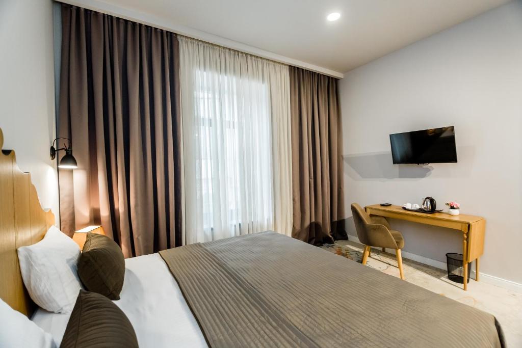 Postel nebo postele na pokoji v ubytování Rasta Maidan Hotel