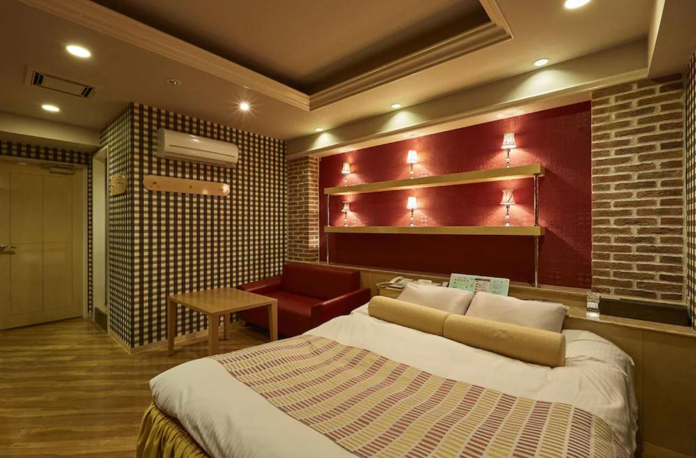 Postel nebo postele na pokoji v ubytování HOTEL K's MINE