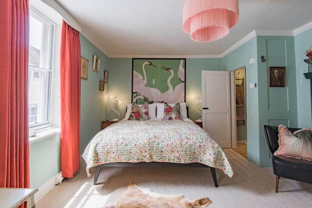 a bedroom with a large bed and a large window at Noggin in Deal