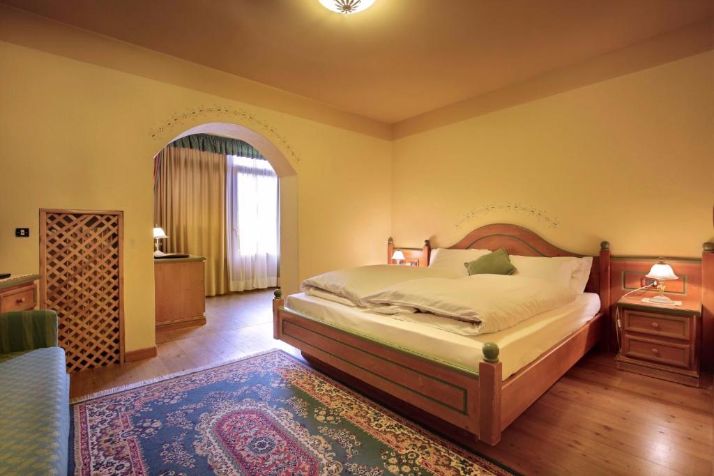 Łóżko lub łóżka w pokoju w obiekcie Park Hotel Leonardo