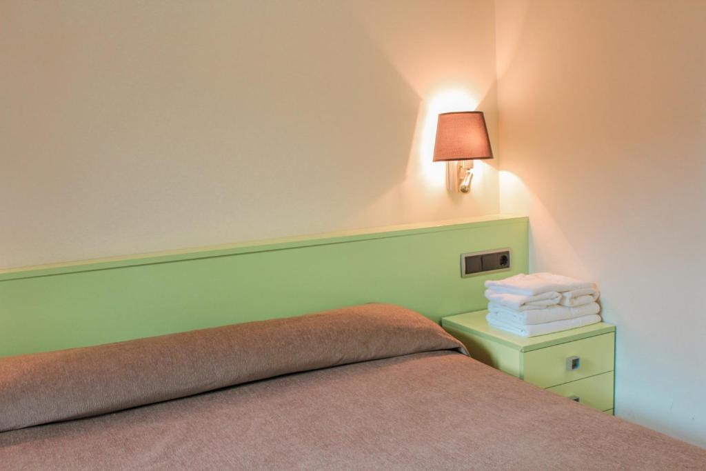Postel nebo postele na pokoji v ubytování Hotel Saloria