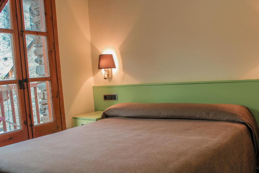 Postel nebo postele na pokoji v ubytování Hotel Saloria