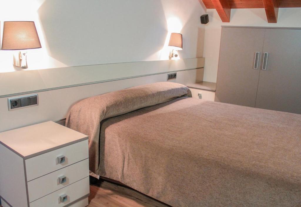Postel nebo postele na pokoji v ubytování Hotel Saloria