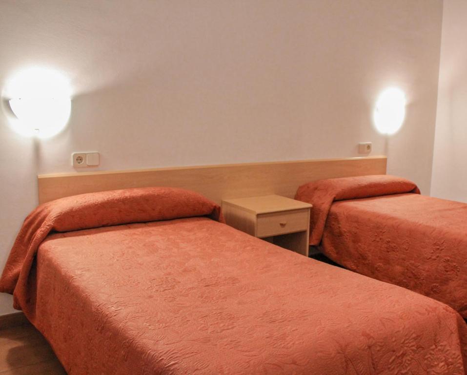 Postel nebo postele na pokoji v ubytování Hotel Saloria