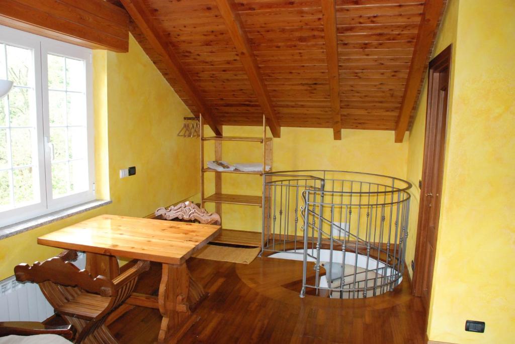 a room with a wooden table and a metal cage at B&B Ca dei Fre in Genova