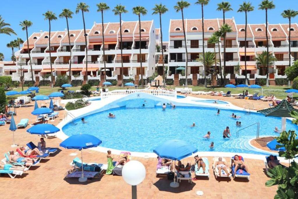 a large swimming pool with people in a resort at Estudio en Tenerife sur, Parque Santiago 2 in Arona