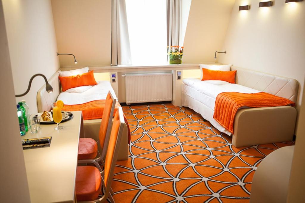 Postel nebo postele na pokoji v ubytování Hotel Eclipse