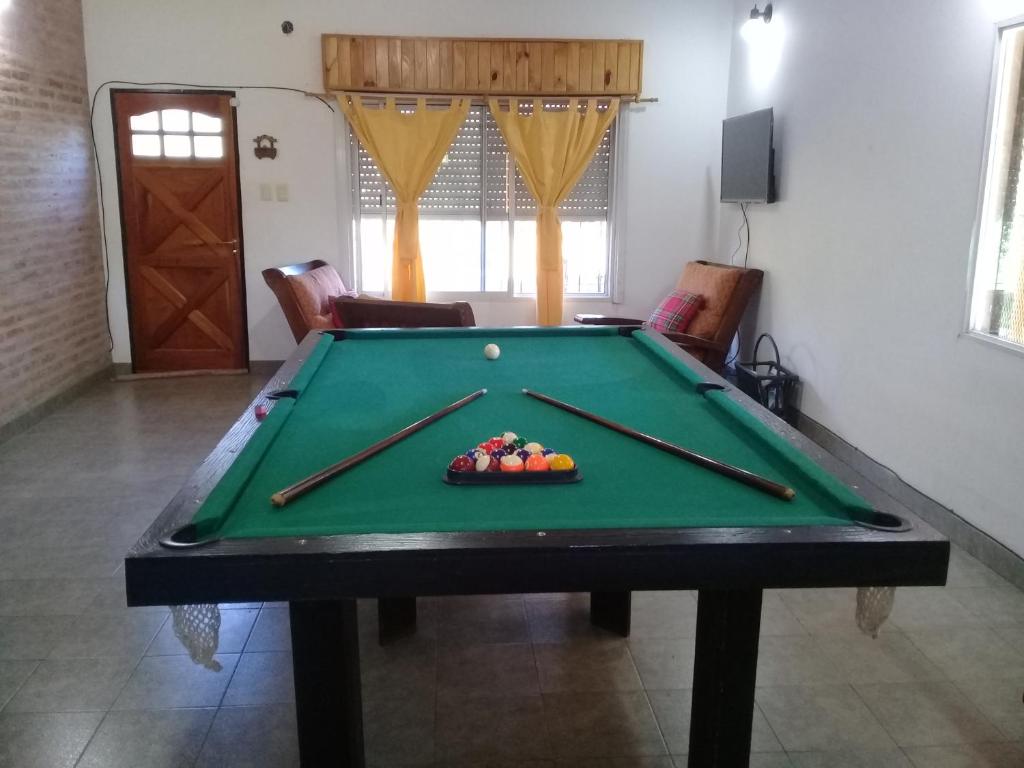a pool table with cue balls on top of it at La Villarense in Buenos Aires
