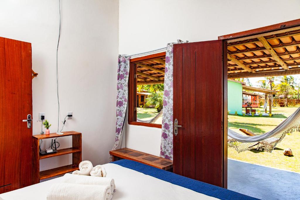 En eller flere senge i et værelse på Pousada Vila Rosa - Caraiva