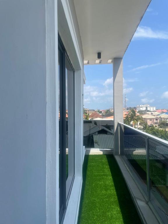 a balcony of a building with green grass at Romel Terraces in Lagos
