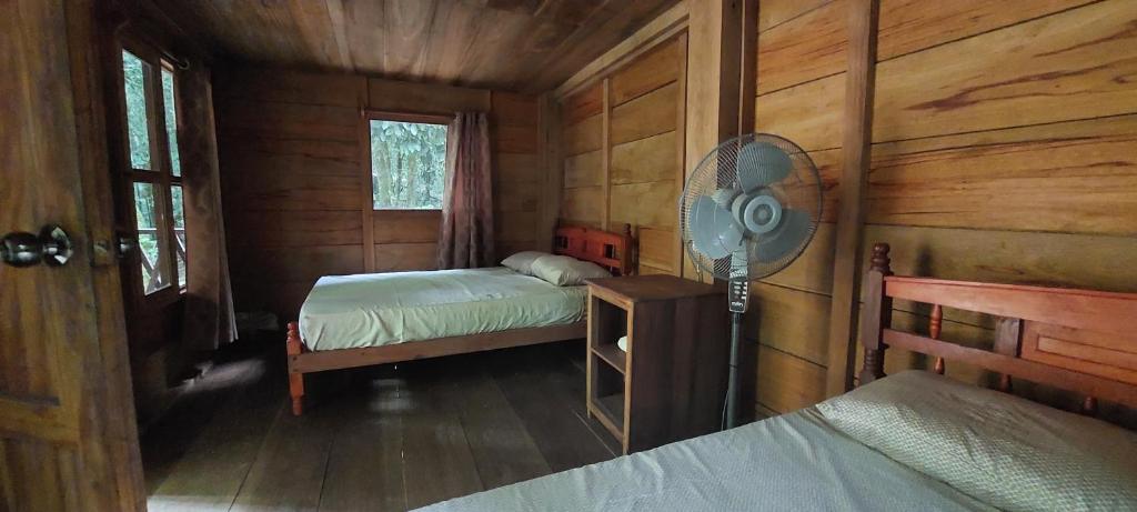 Postel nebo postele na pokoji v ubytování Cabaña Tu´ur