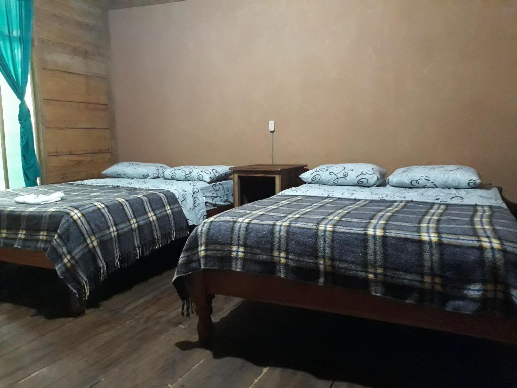 Postel nebo postele na pokoji v ubytování Cabaña Tu´ur