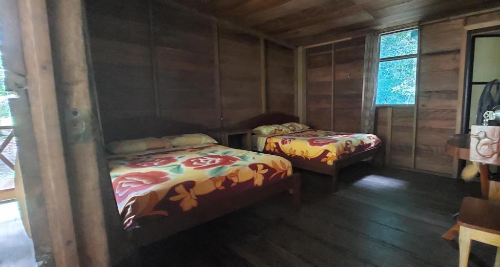 Postel nebo postele na pokoji v ubytování Cabaña Tu´ur
