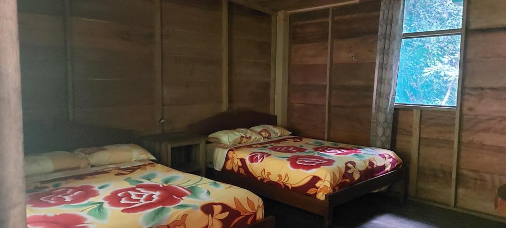 Postel nebo postele na pokoji v ubytování Cabaña Tu´ur