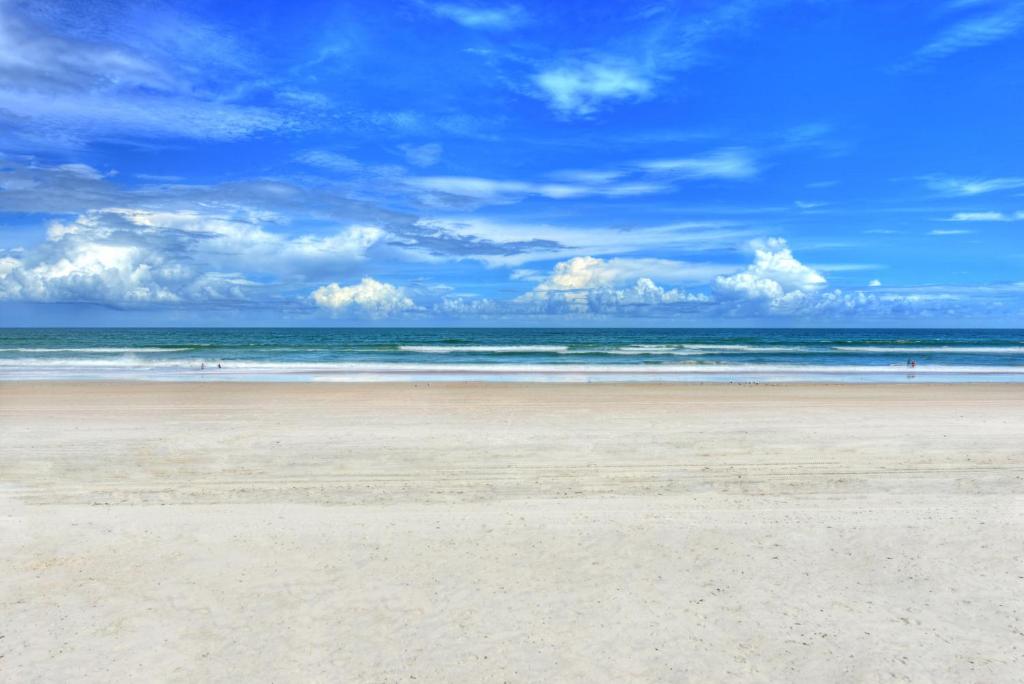 a sandy beach with the ocean in the background at Daytona Beach Resort Condos in Daytona Beach