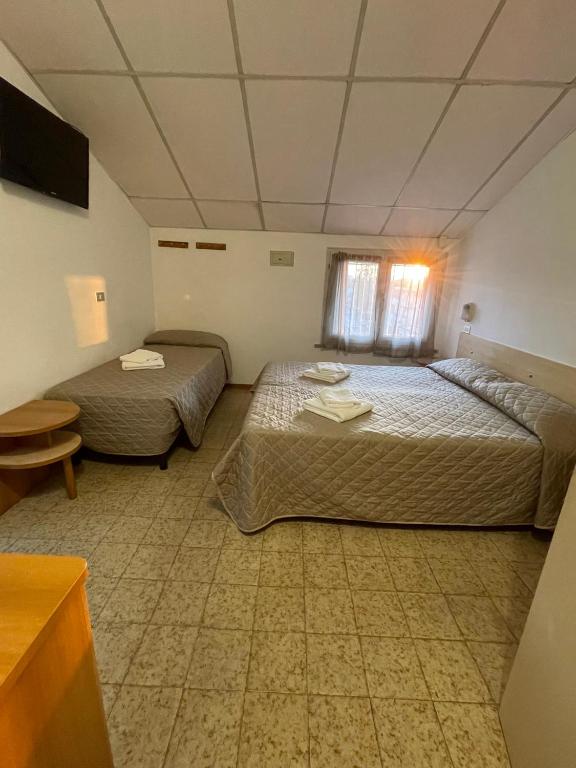 Postel nebo postele na pokoji v ubytování Hotel Adler