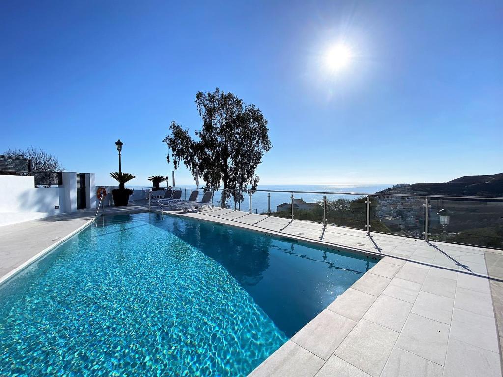 a swimming pool with a view of the ocean at Balcon del Mar Seaview 114 Casasol in Nerja
