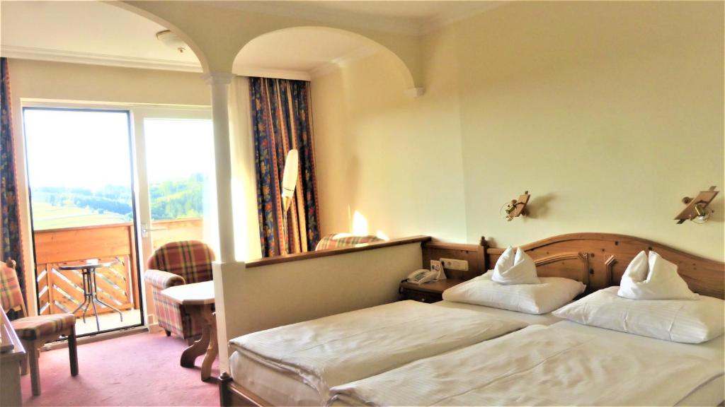 Postel nebo postele na pokoji v ubytování Hotel - Café - Konditorei Schröckmayr-Kastner