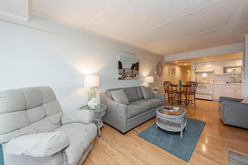 a living room with a couch and a table at 105A Efficiency One Bath in Oakland