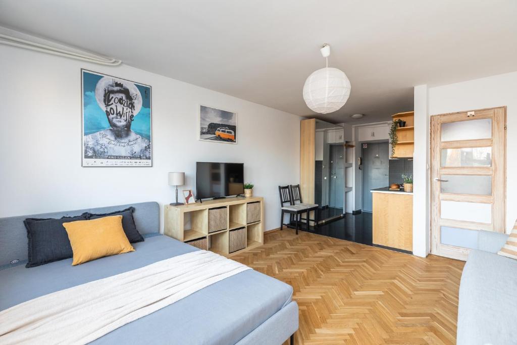 a bedroom with a bed and a television in it at SuperApart ulica Wilanowska 10 in Warsaw