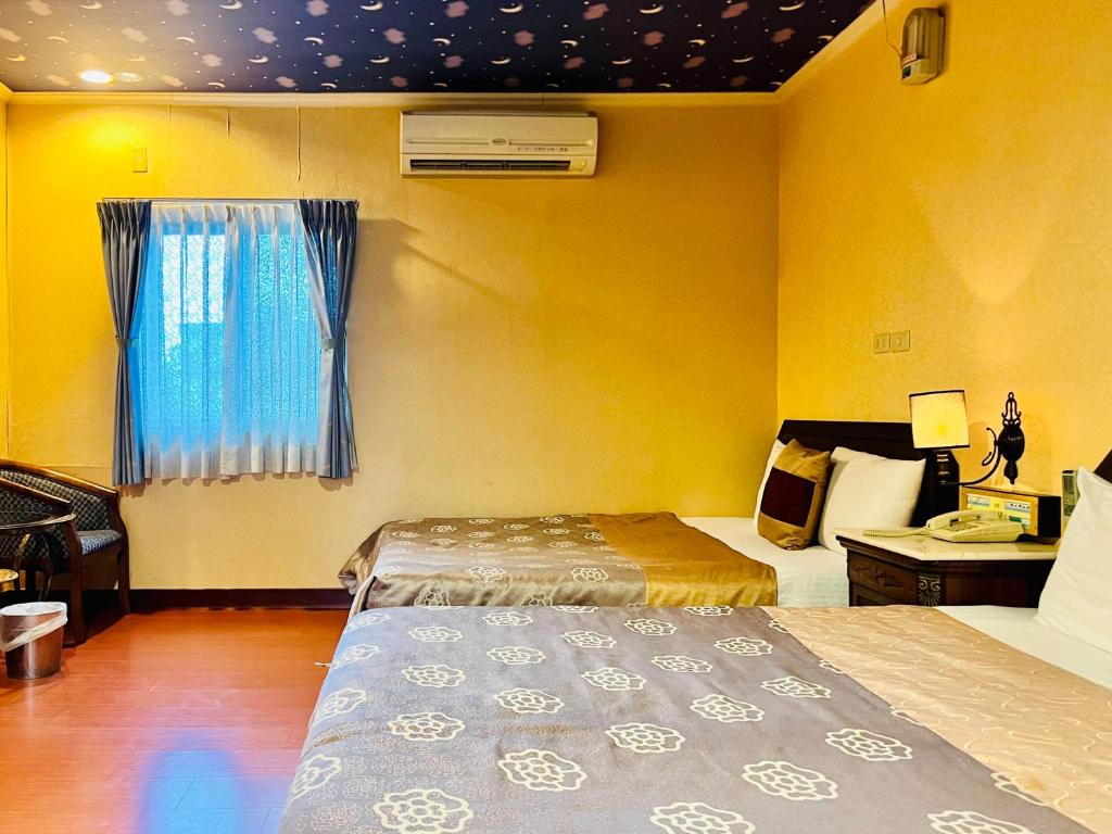 Postel nebo postele na pokoji v ubytování Shinyes Motel