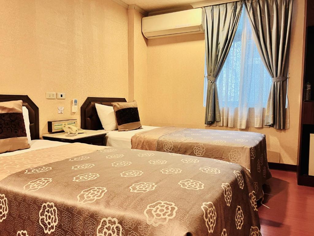 Postel nebo postele na pokoji v ubytování Shinyes Motel