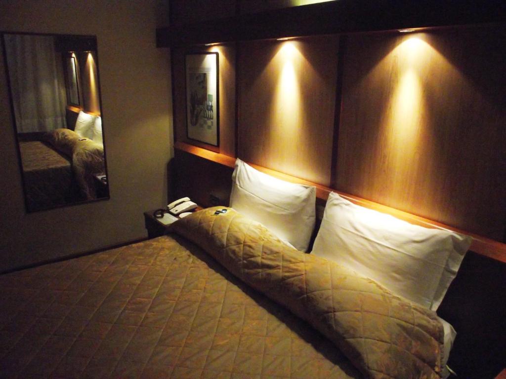 Postel nebo postele na pokoji v ubytování Hotel Motel Ovest