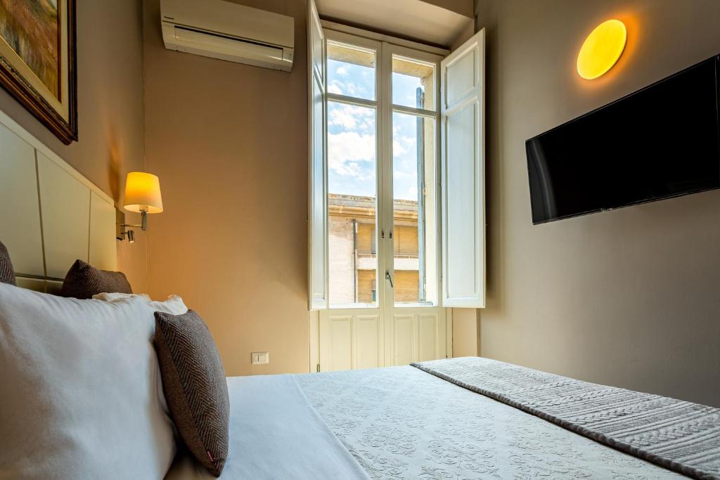 Posteľ alebo postele v izbe v ubytovaní Marlin Rooms