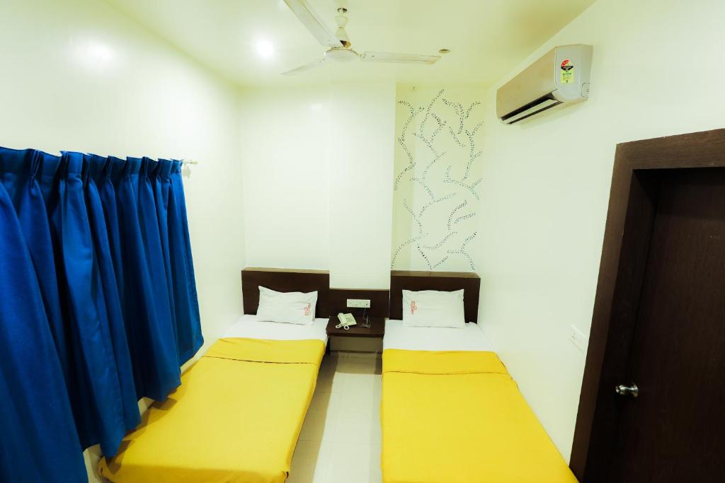 Postel nebo postele na pokoji v ubytování Hotel Solitaire
