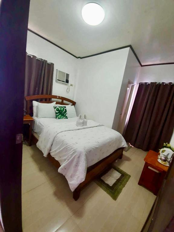 Postel nebo postele na pokoji v ubytování Kalis Viewpoint Lodge Coron