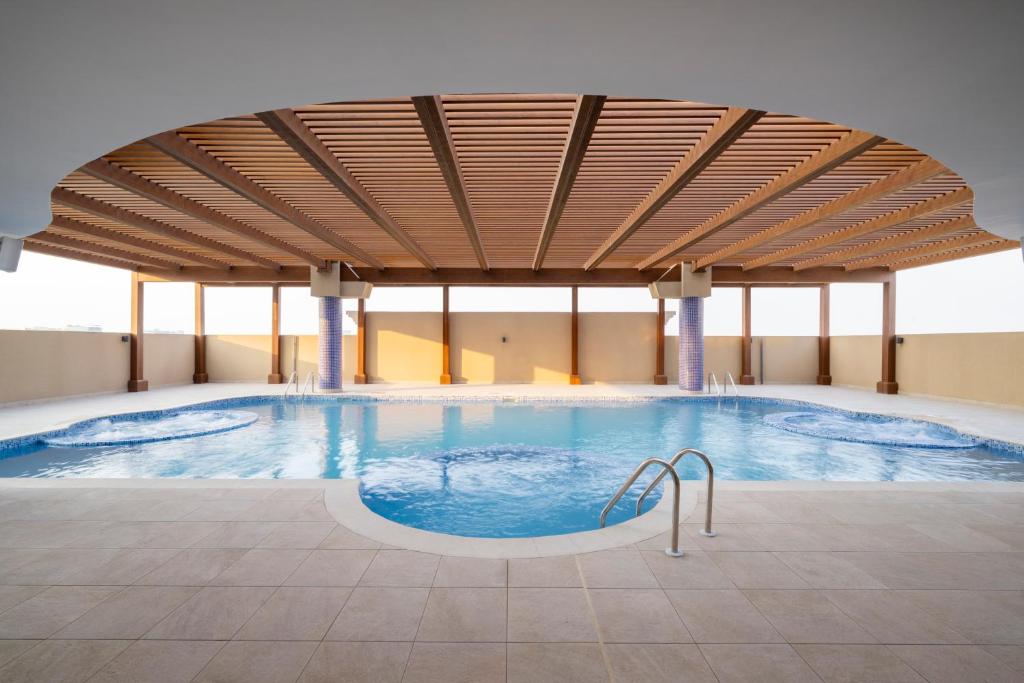 Bazén v ubytování La Maison Hotel Doha nebo v jeho okolí