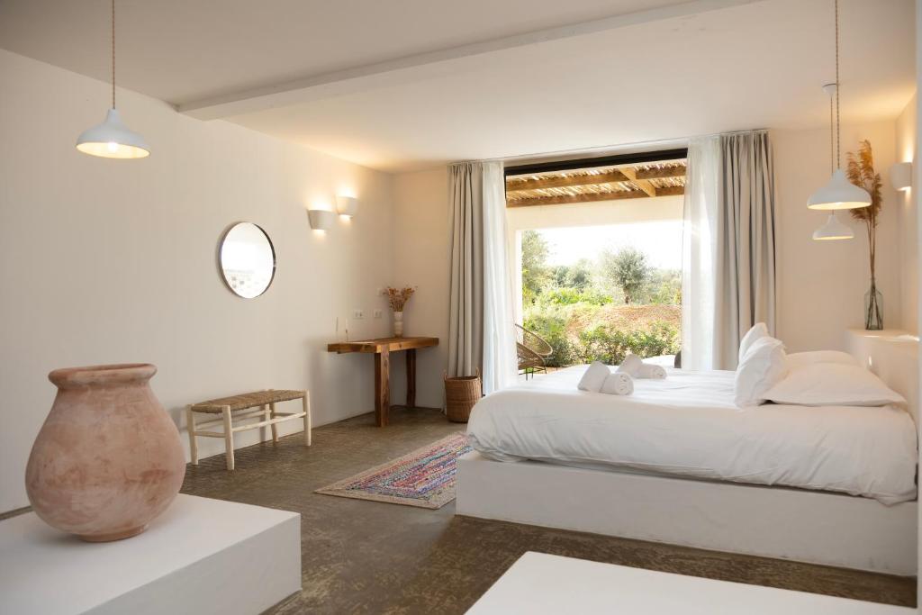 Postel nebo postele na pokoji v ubytování VILLA FLAKA Boutique Hôtel Confidentiel et Convivial