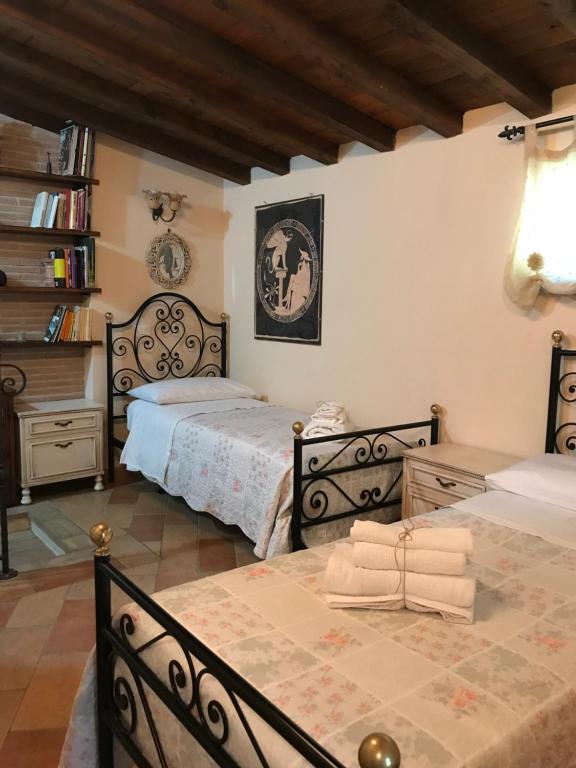 Posteľ alebo postele v izbe v ubytovaní Villa Adriana House - alloggio turistico ID 18021