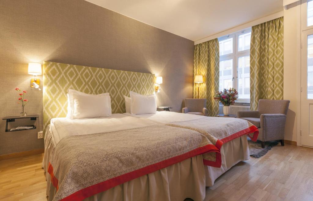 Postel nebo postele na pokoji v ubytování Home Hotel Wellington