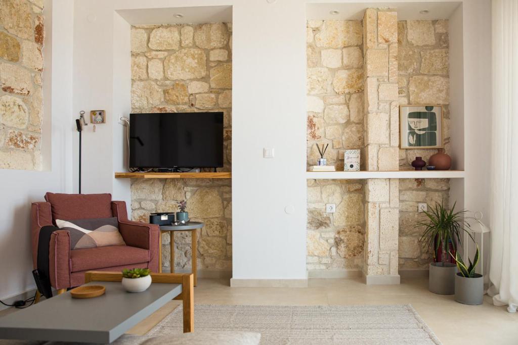 Televízia a/alebo spoločenská miestnosť v ubytovaní ArtHill eco villas