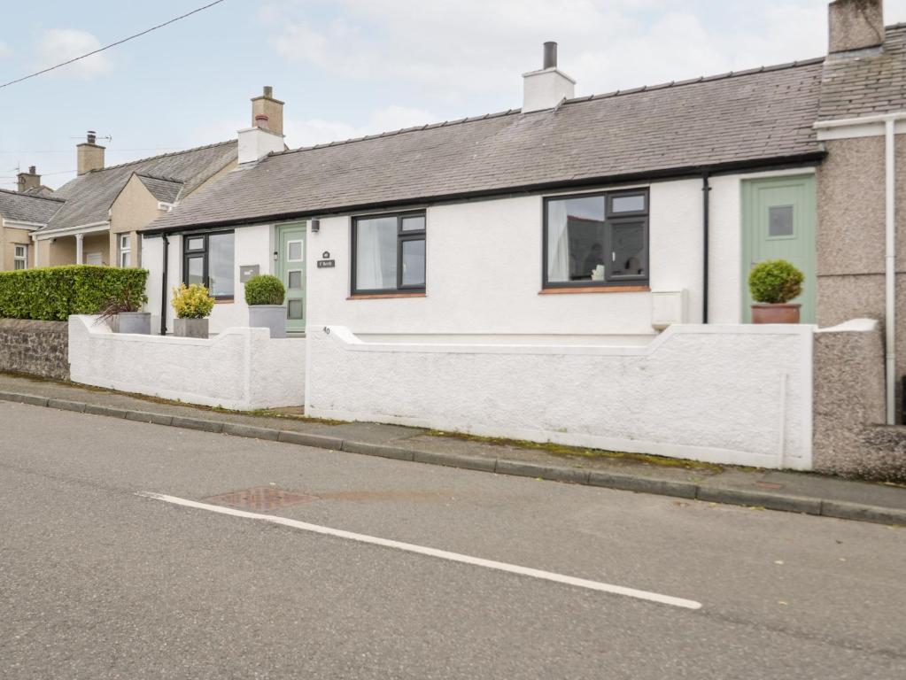 a row of houses on the side of a street at 40 Llaneilian Road in Amlwch