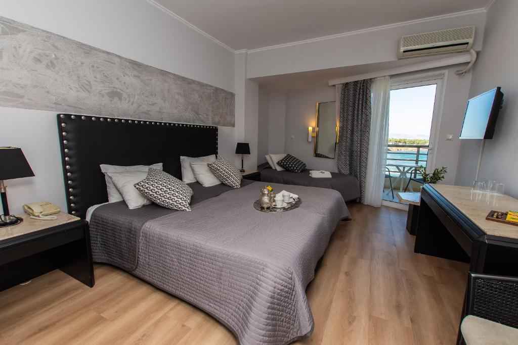 Postel nebo postele na pokoji v ubytování Mati Hotel